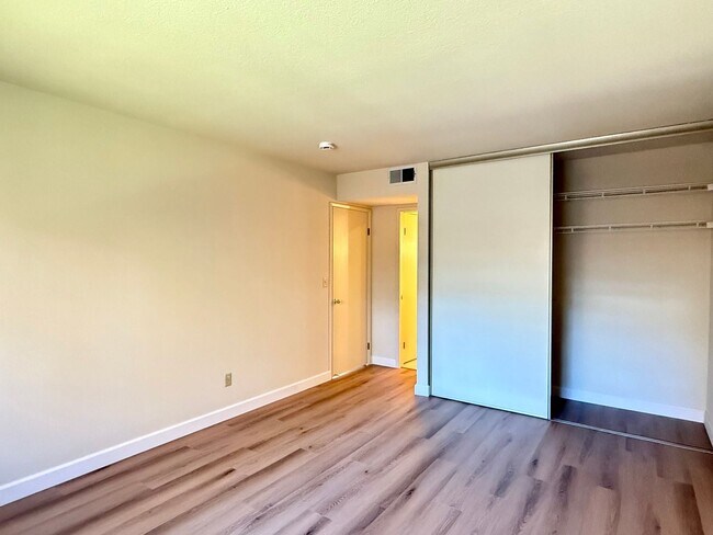 Building Photo - New Vinyl Plank Flooring, Fresh Interior Paint, 1 Car Garage + 1 Assigned Outdoor Parking Space -...