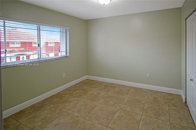 Building Photo - 10953 W Okeechobee Rd