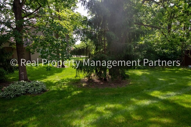 Building Photo - Spacious 3BR Townhome in Lowell | Nature Views & Maintenance-Free Living