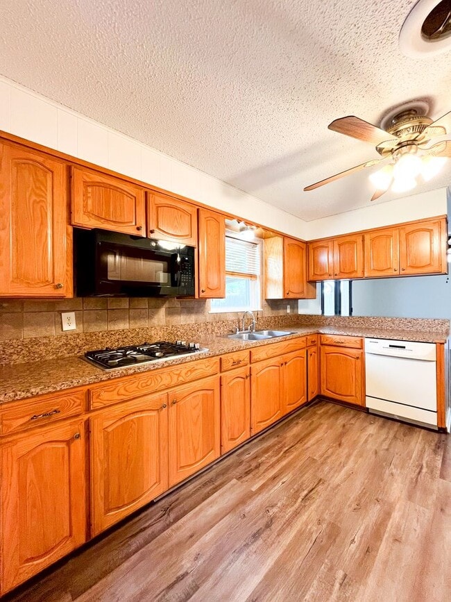 Building Photo - Available Now!!!! Gorgeous 3 bedroom, 2 bath, 2 car garage home. Beautiful wood look flooring. Sp...