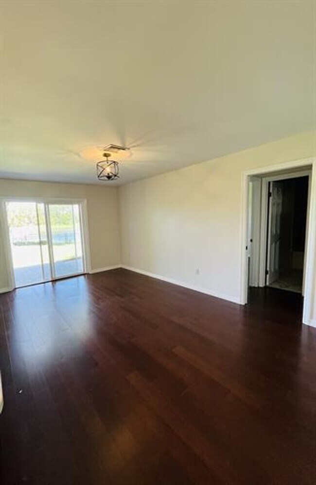 Building Photo - Eustis Lake Front Home with 2 Primary Bedr...