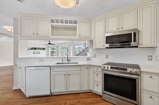 Building Photo - Available Now! Waterfront Living at Its Best – Pool, Decks & Gated Privacy
