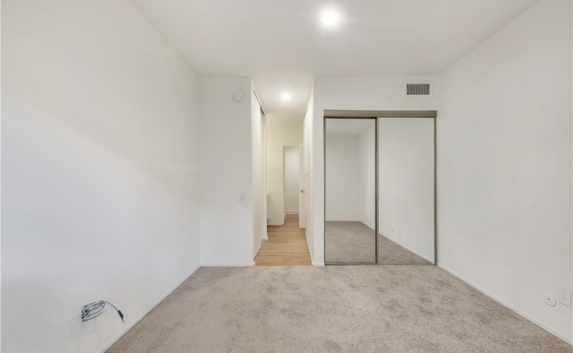 Replaced carpet with wood vinyl floor - 5460 White Oak Ave