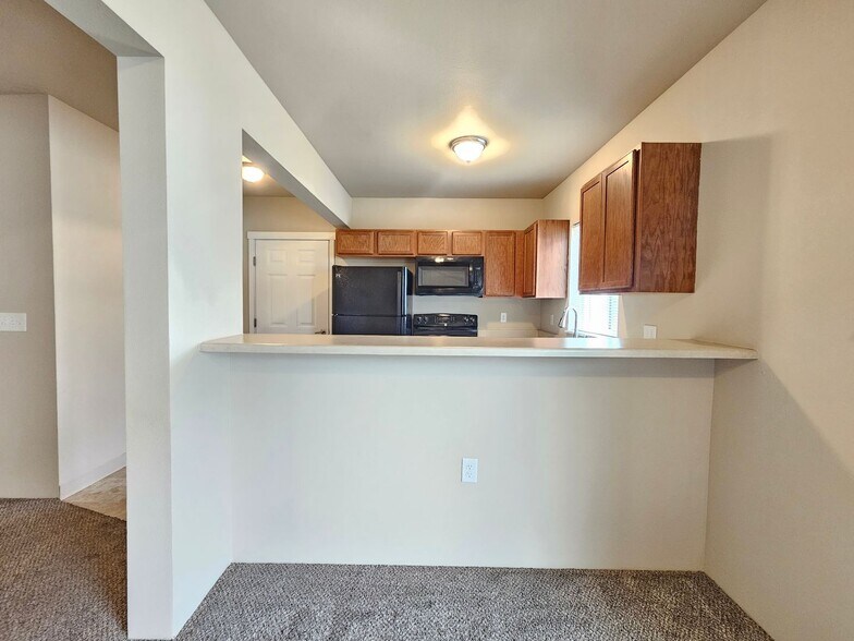 Building Photo - 5205 -5207  E. Upriver Dr.