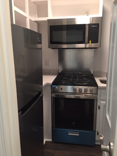 The Kitchen includes a stainless steel gas stove/oven, microwave and refrigerator - 3819 Gallatin Pike