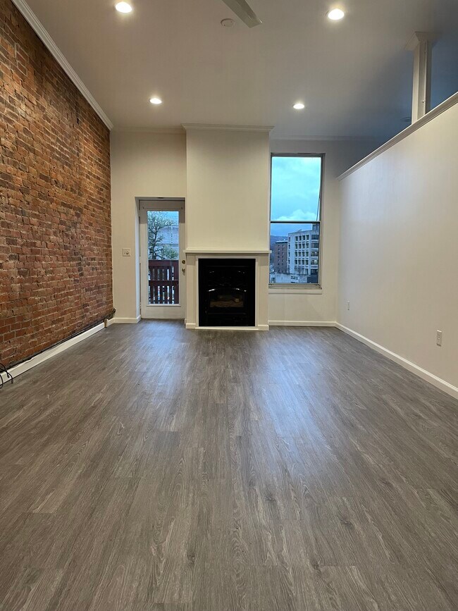 Gas fireplace and door to balcony - The Garland