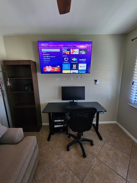 Adjustable desk raises and lowers at the touch of a button. Convenient monitor and printer. - 5050 N 81st St