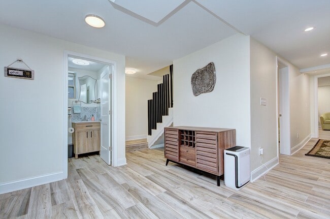 Building Photo - Discover the charm of this FULLY FURNISHED basement unit, tucked away in a beautifully updated bu...