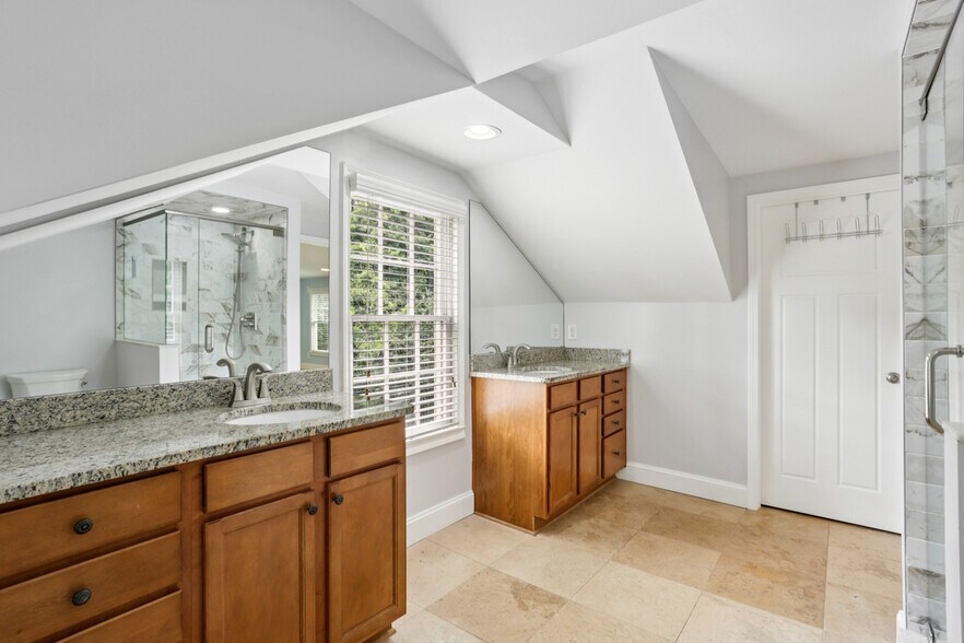 Large primary bathroom, newly renovated shower with double vanity and walk in closet - 781 Rosedale Ave SE