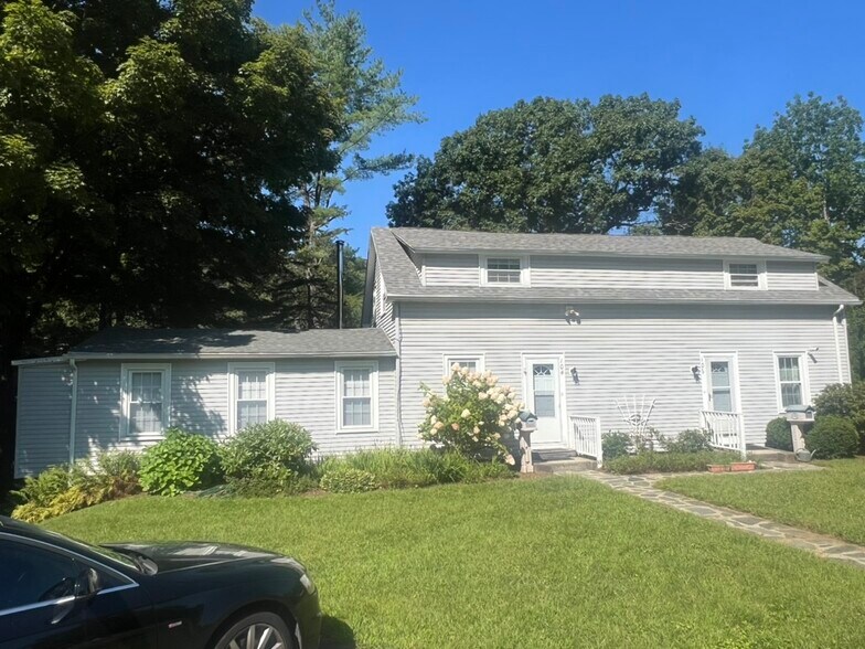 Front of House, Larger Unit for Rent on Left - 104 Main St