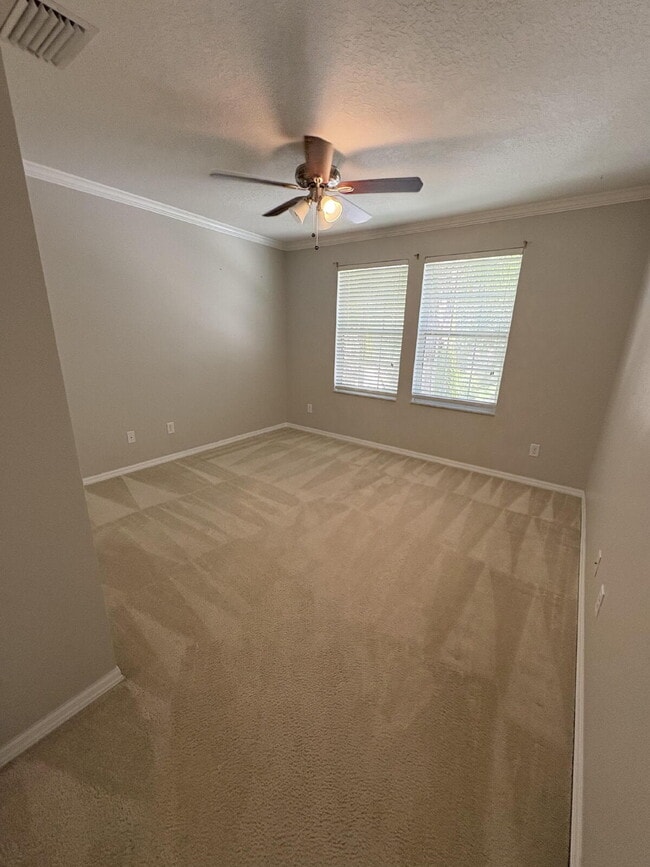 Building Photo - Spacious 5-Bedroom Pool Home with Putting ...