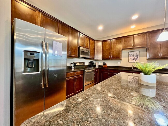 Building Photo - Executive corporate rental features community pool. Fully furnished and includes all utilities.