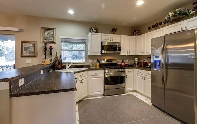 Building Photo - Charming 4-Bedroom Home with Pond Views & ...