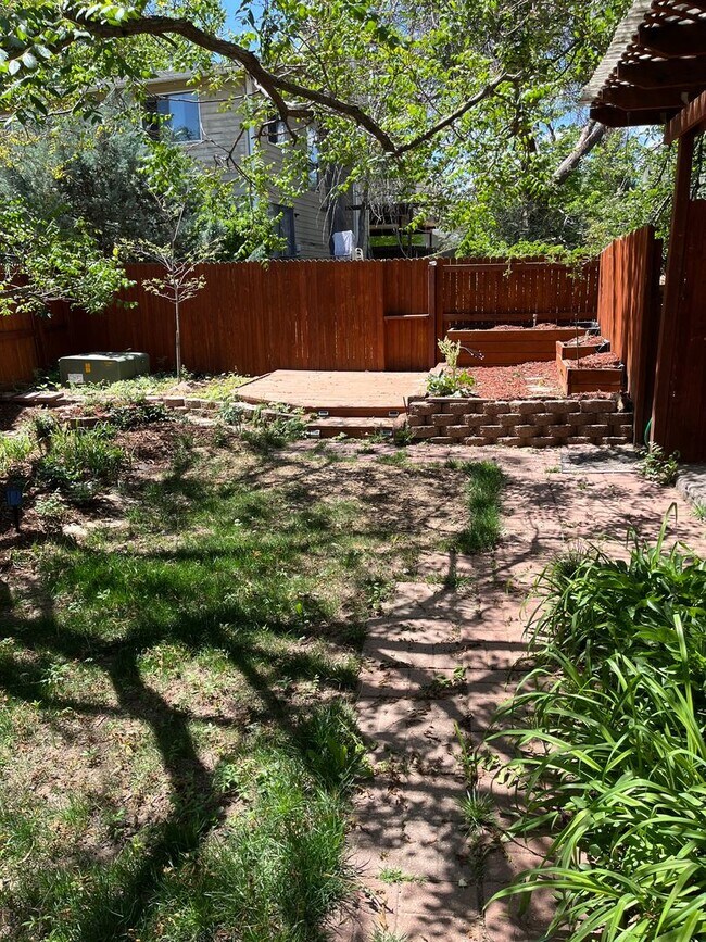 Building Photo - 4 Bedroom Gardener's Delight With Rooftop Patio, Privacy and Covered Parking