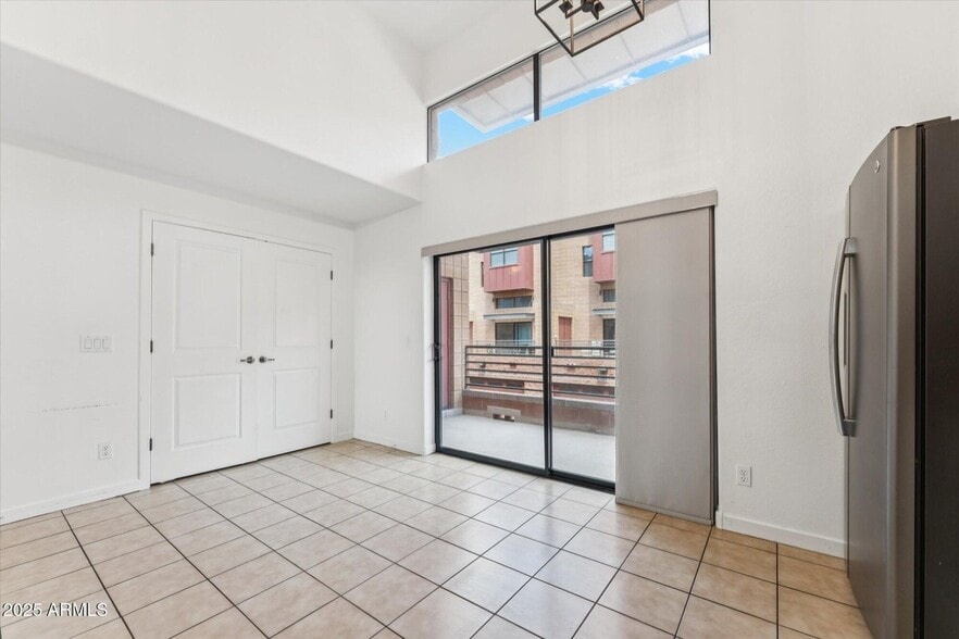 kitchen with washer dryer behind closet doors - 330 S Farmer Ave