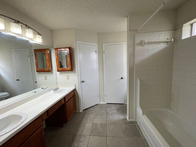 Building Photo - SPACIOUS HOME - NEW FLOORING! - 2 LIVING A...