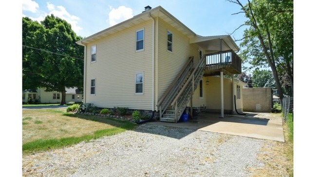 view of upper unit, patio and entrance - 100 S Rochester St