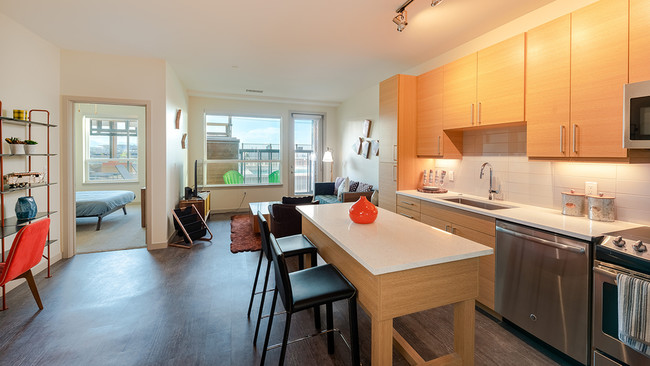 Kitchen area with stainless steel appliances and island - Modera River North