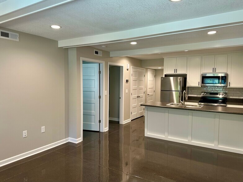 Open, airy plan with beamed ceiling - 2304 Belle Ave NE