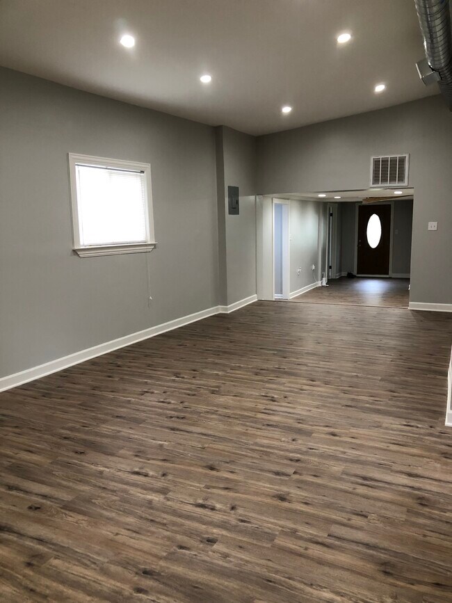 View of living room from the back of the house towards the front door - 1050 Janet Dr