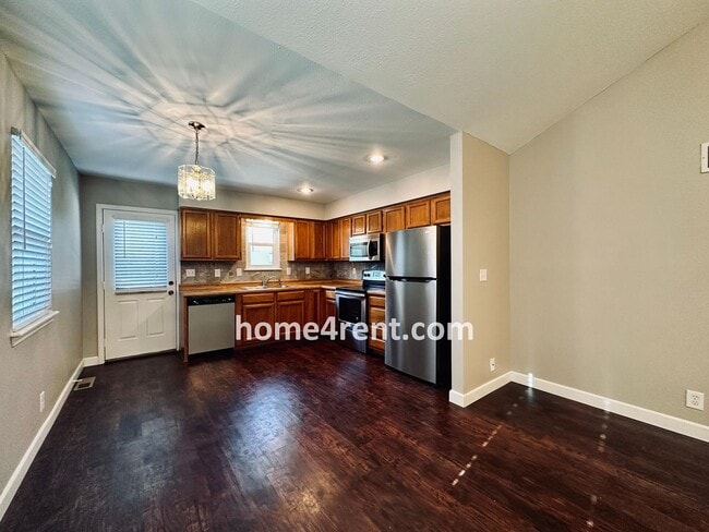 Building Photo - Updated Kitchen, Composite Deck and Refrig...