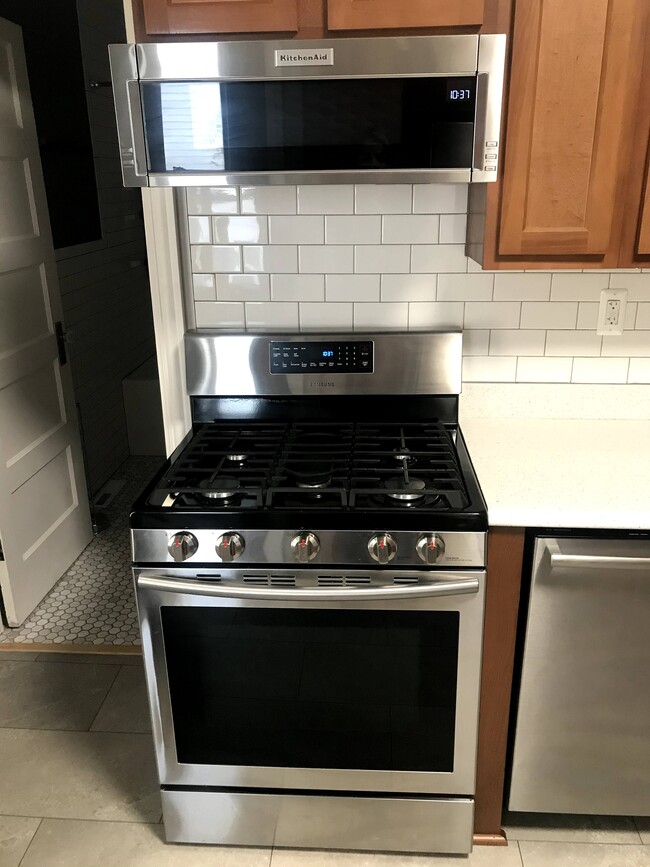 Gas Range and new microwave. - 1233 Jenifer St