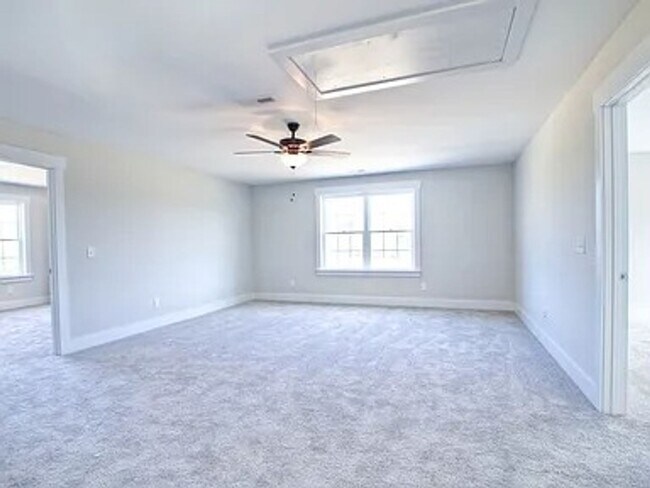 Building Photo - Situated on over 3 acres right in a growin...