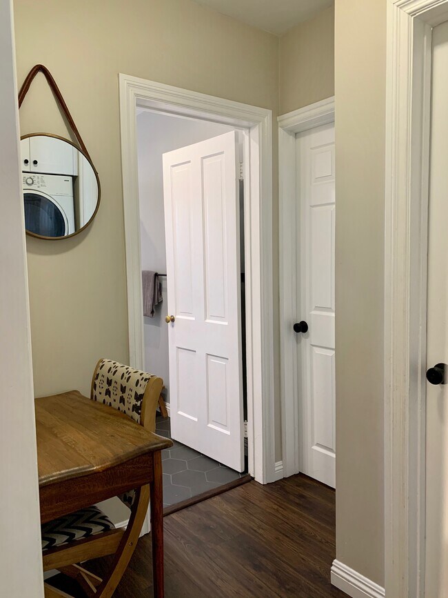 hallway facing bathroom door - 900 N El Molino Ave.