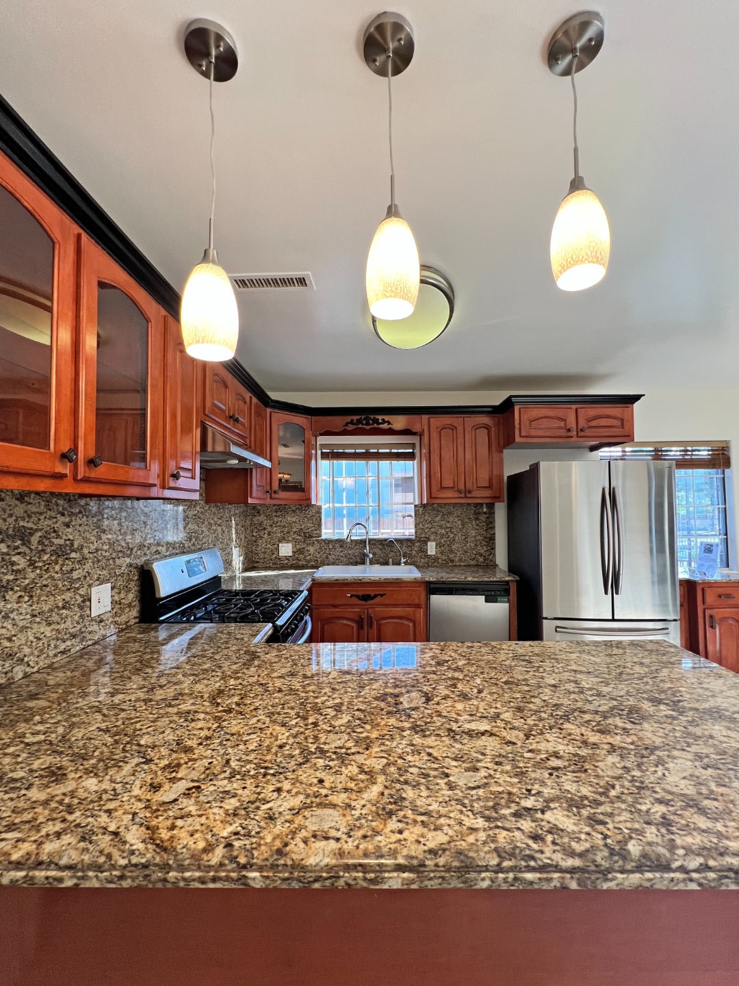 Kitchen with stainless steel appliances (no microwave). - 2330 S Mansfield Ave