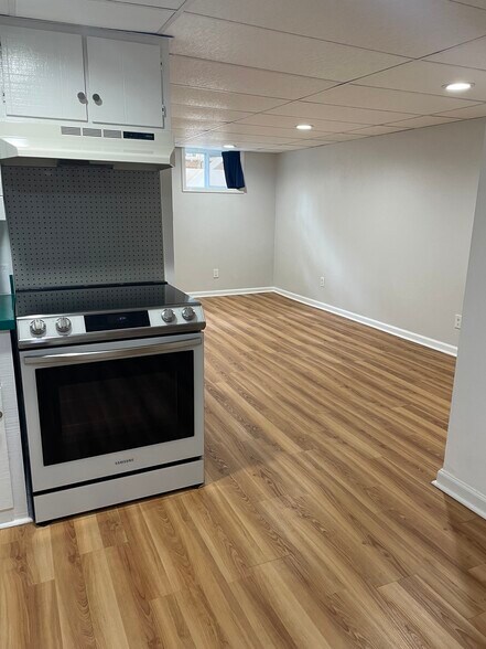 Kitchen, with induction stove. - 2323 Crestmont Ave