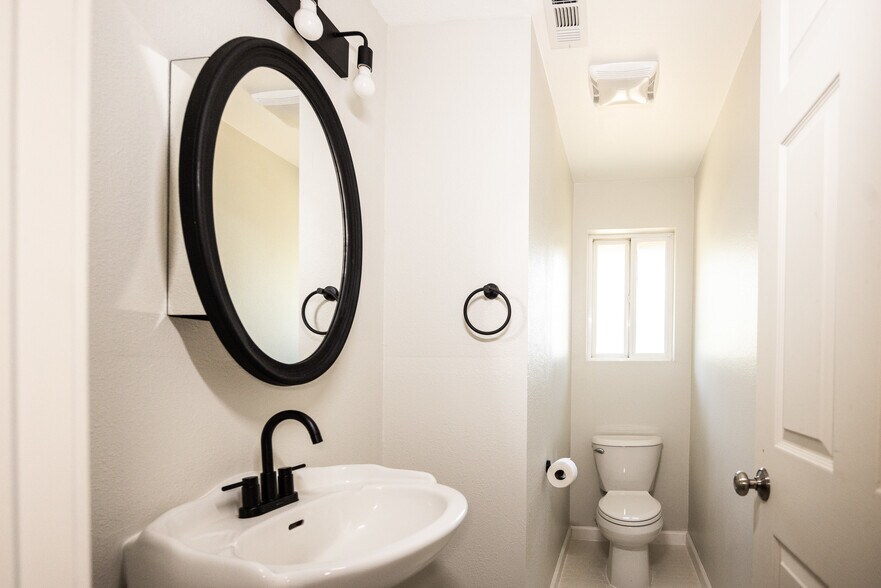 Half bath. Second door on left at the end of the hallway - 8717 NE Webster St