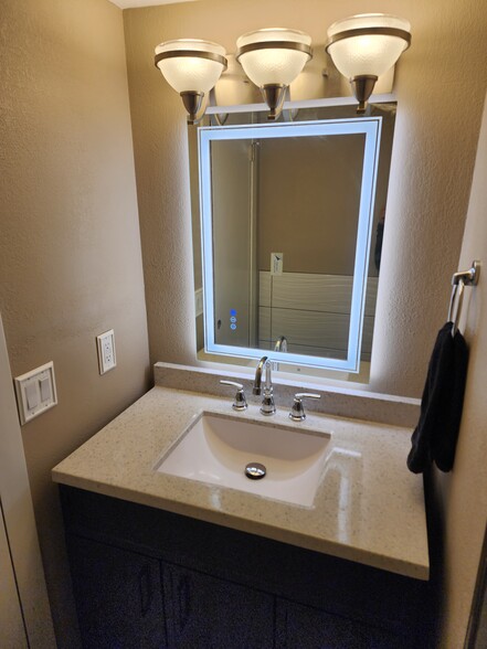 Lit up mirror in half bath - 135 Ridge Ct