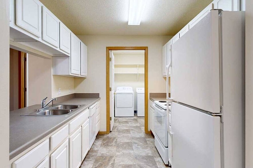 Enjoy the convenience of an in-home laundry room just off the kitchenideal for multitasking on busy days. - Northbrook Apartments