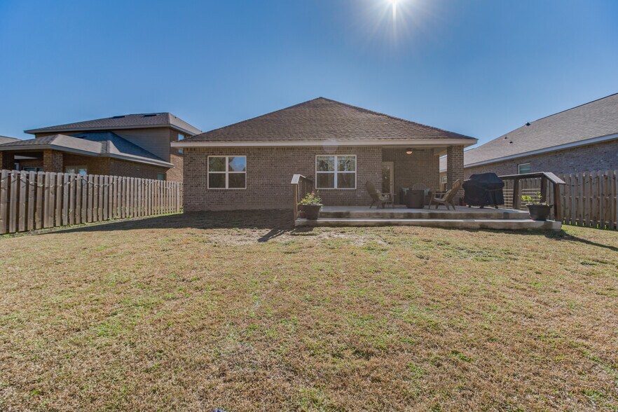 Extended patio/fence completed by homeowners - 3618 Hawks Landing Cir