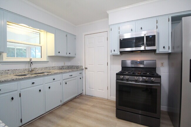 Building Photo - Spacious 4BR, 2BA Central Pensacola Home on a Large Corner Lot with Sunroom & 2-Car Garage