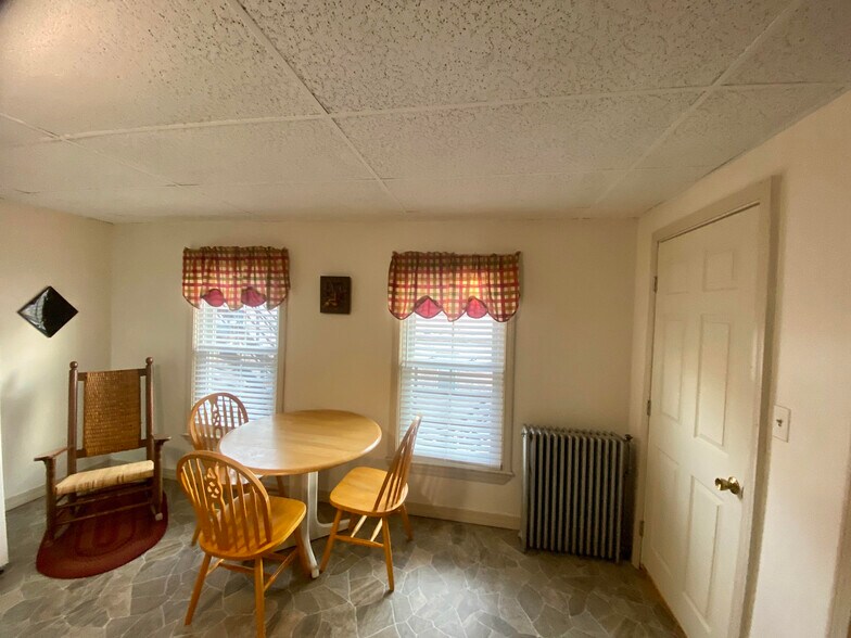 Kitchen and entrance door to apartment, area could become sitting area in the event the living room converted to bedroom. - 154 College St