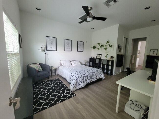 Massive primary bedroom offers plenty of room for sleep and sitting areas - 207 Pierce St