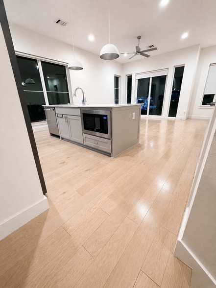 Kitchen/Living room at night, has roller shades you can use for privacy - 5605 Bryan Pky