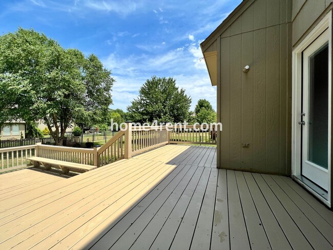 Building Photo - Updated Kitchen, Large Two Tiered Deck, Finished Basement in Blue Valley Schools!