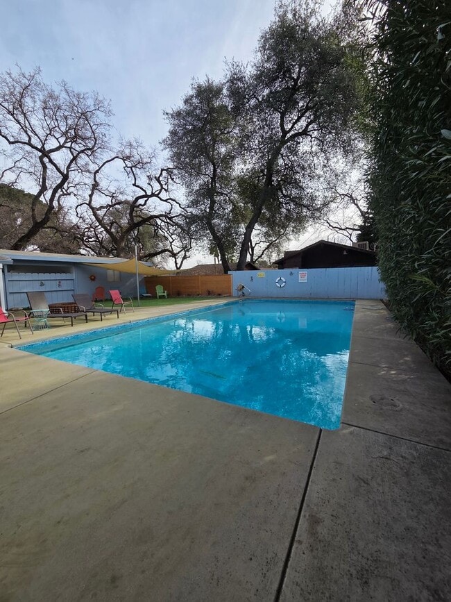 Building Photo - Beautifully Furnished and Recently Painted, Corner Lot Home Features a Fenced Backyard with an In...