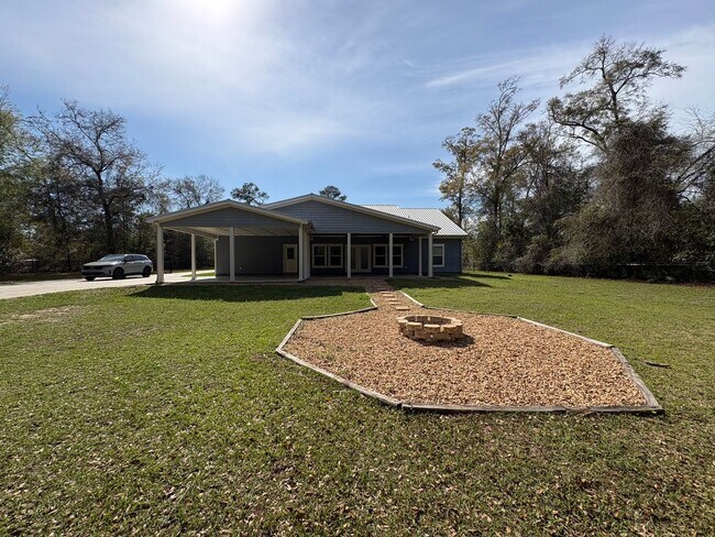 Building Photo - Available Now: Expansive 4BR Home with Rare 3-Bay Carport
