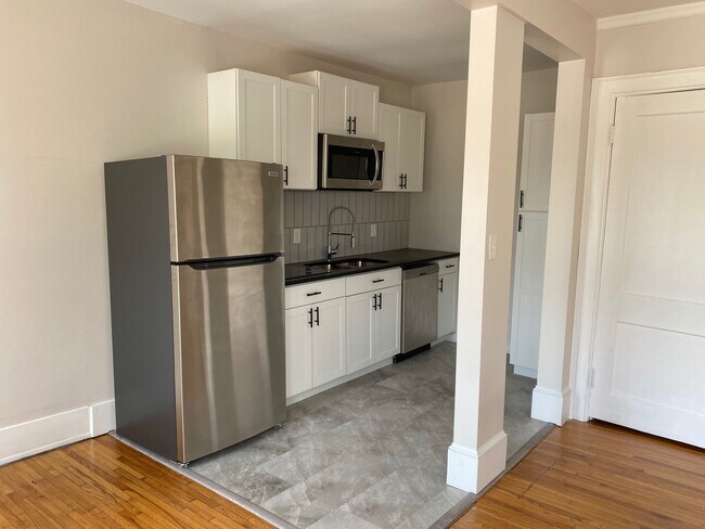 Renvoated kitchen, new appliances, cabinets and fixtures - 324 E 8th St