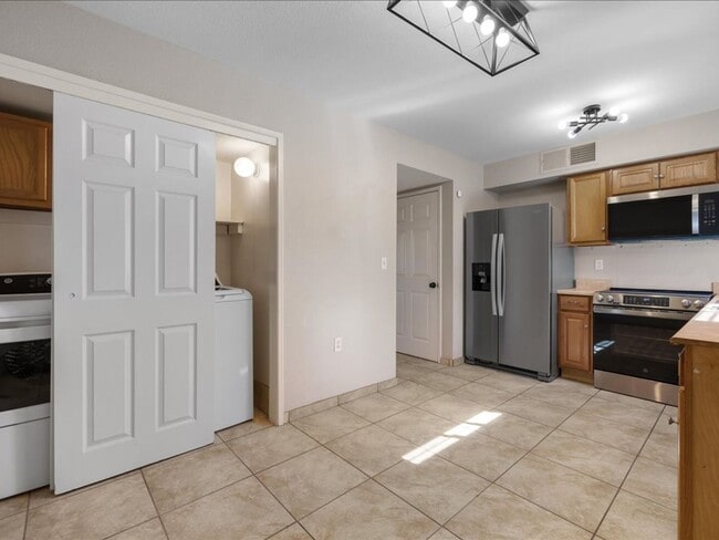 Building Photo - Two-Story Home with Brand New Appliances & Private Turf Backyard!