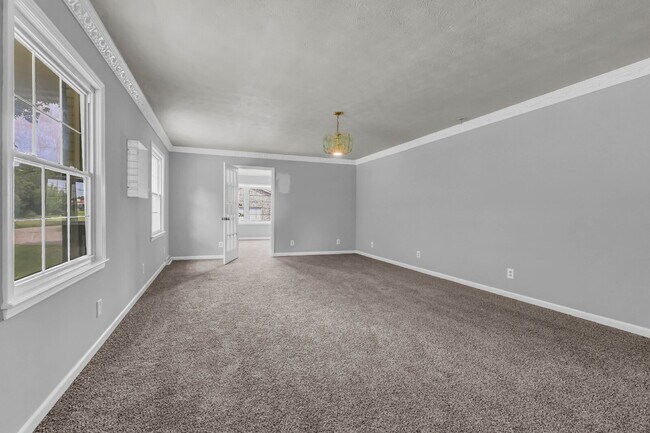 Building Photo - spacious 4-bedroom, 2.5-bath home featuring a 2-car garage and fresh updates throughout.
