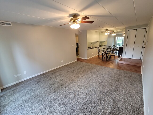 Living area with hard wood dining area - 13515 Le Claire Ave