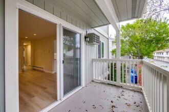 Building Photo - Refreshed 2/2 Second Floor Campbell Condominium in Great Location! Attached Garage & Additional S...