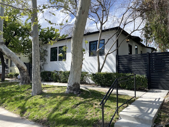 Front of Triplex with secured gated access and perimeter security cameras - 3211 W Alameda Ave