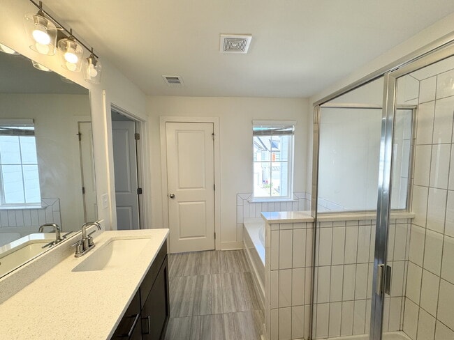 Building Photo - Stylish 3BR Townhome with Private Yard & T...