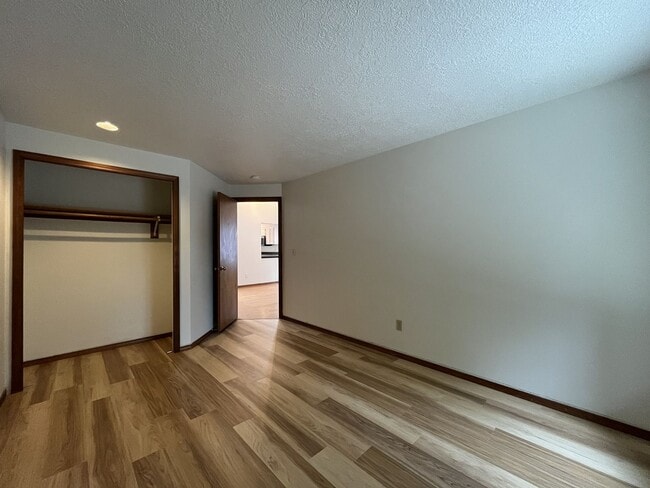 Building Photo - Spacious 3-Bedroom Home with Custom Stone Fireplace, Attached 2-Car Garage & Expansive Backyard i...
