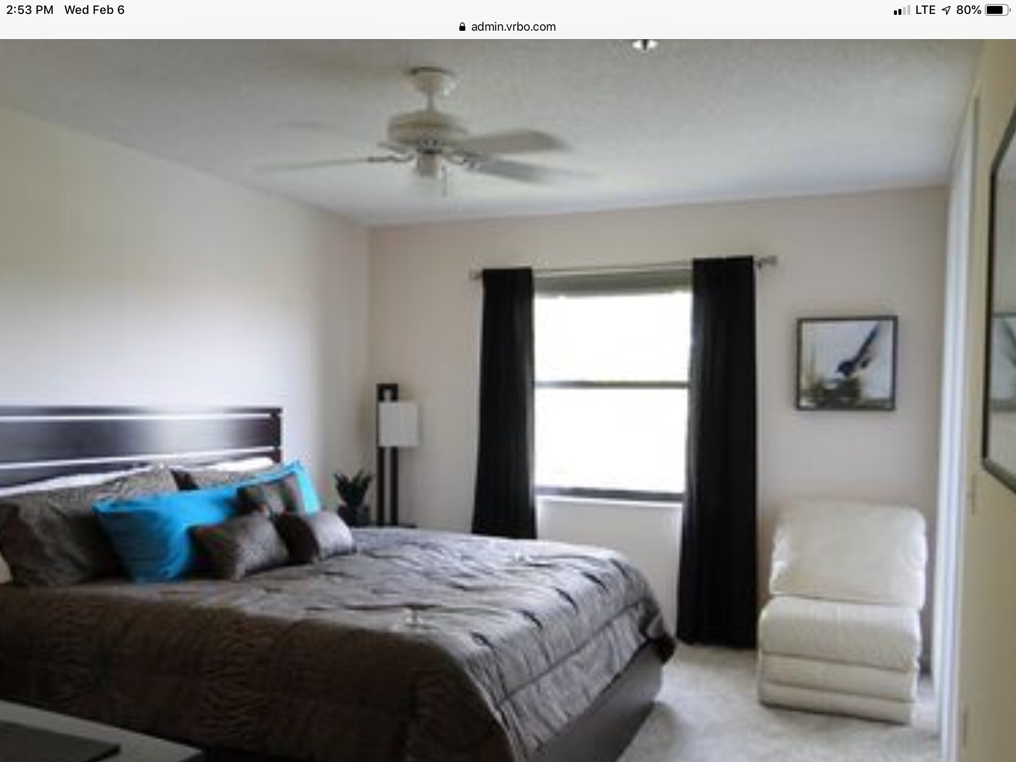 Master bedroom with ceiling fan overlooking pond. Slider access to glass enclosed balcony. - 5265 Brisata Circle